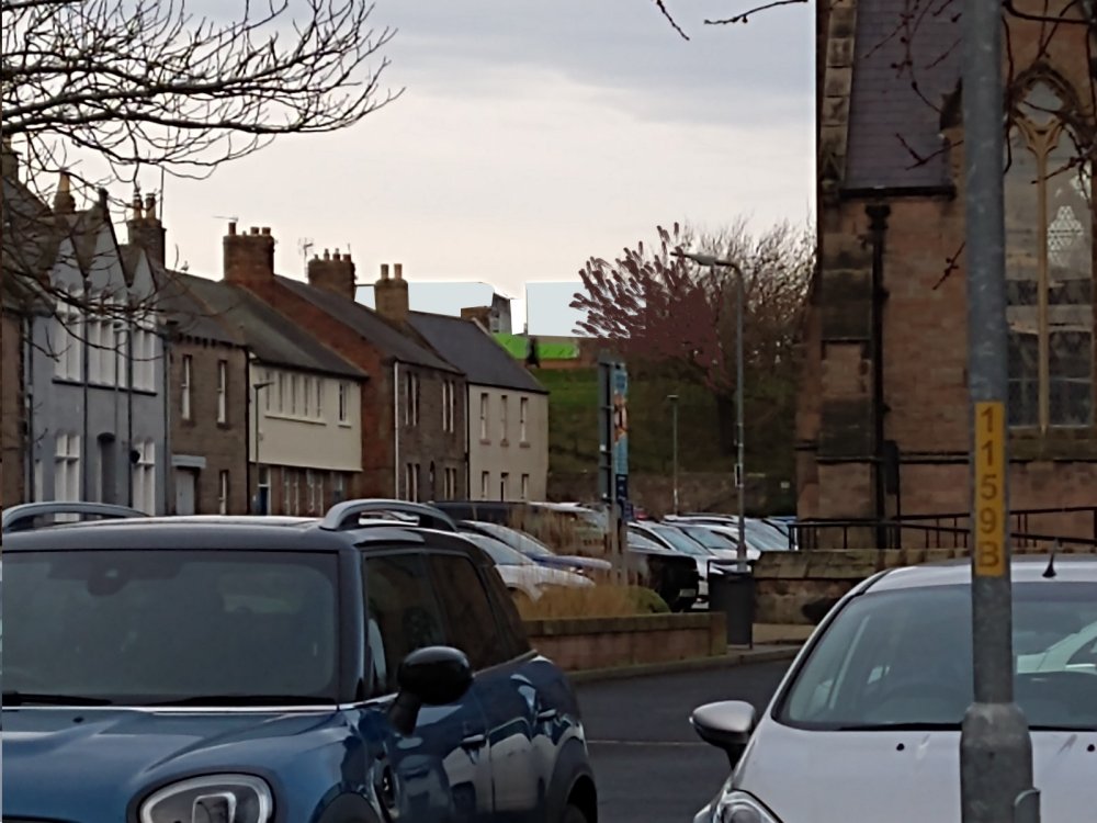 Hospital pods from Parade: light blue-grey against an overcast sky